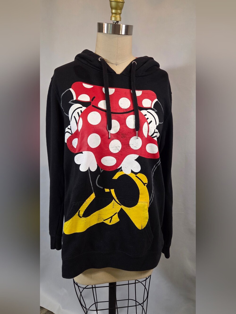 black Disney Minnie Mouse graphic hoodie featuring a red-and-white polka-dot bow